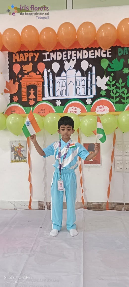 A student holding the Indian flag during a school celebration
