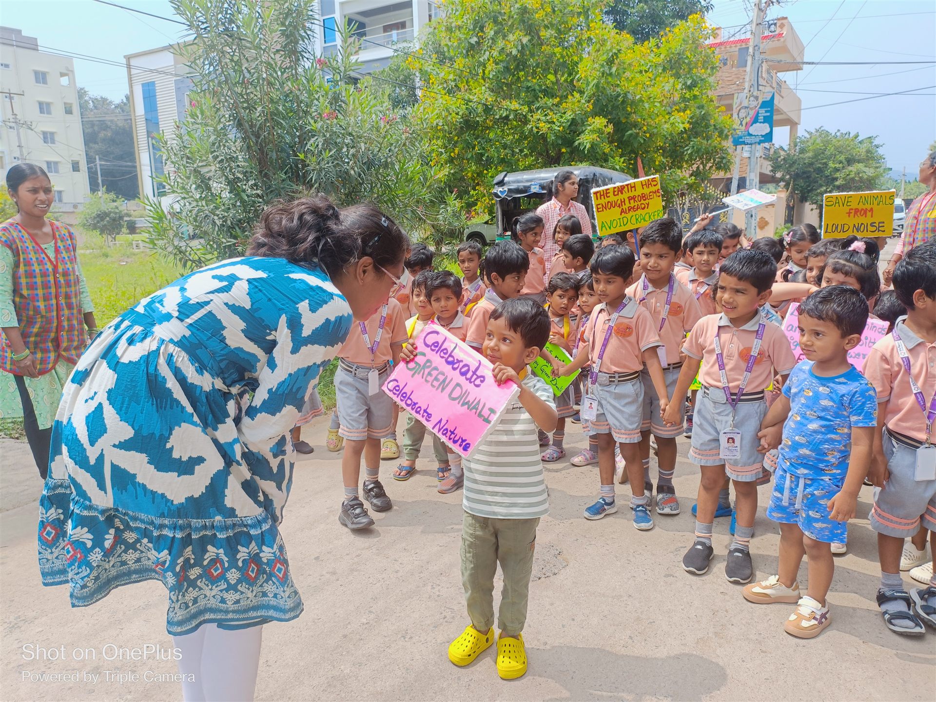 Children holding Green Diwali awareness placards