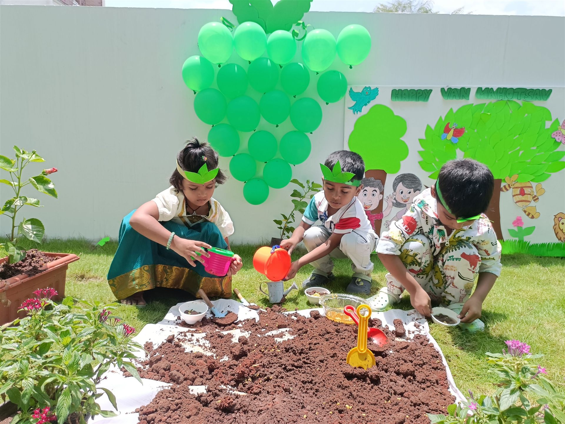 Children planting saplings on Van Mahotsav
