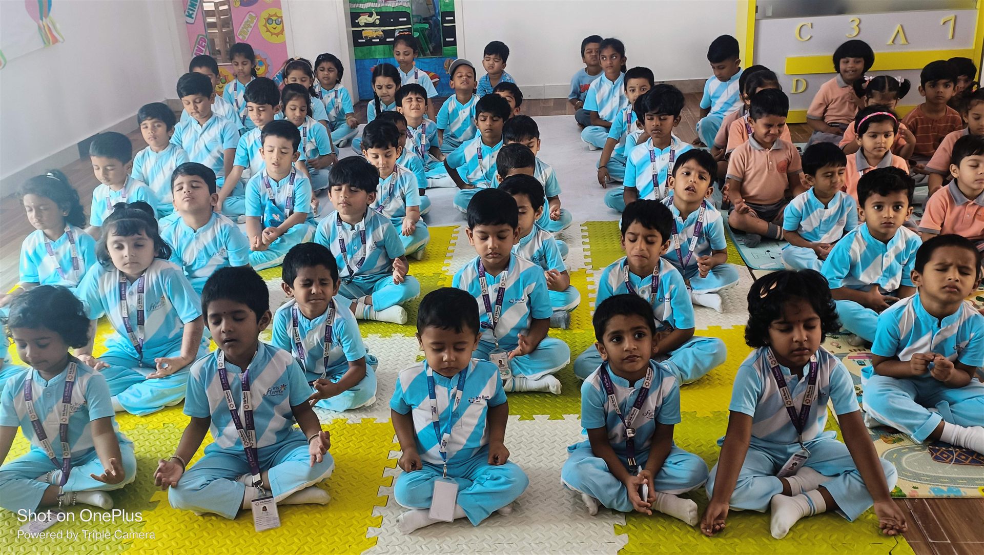 Children practising yoga together